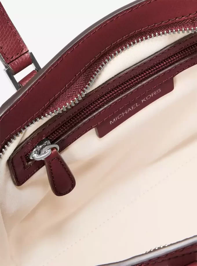 Taryn Mała skórzana torba typu crossbody z możliwością przekształcenia Taryn Mała skórzana torba typu crossbody z możliwością przekształcenia